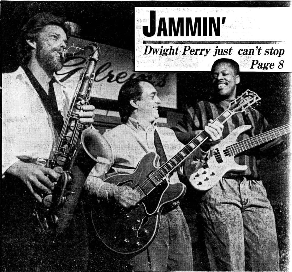 Photo of Charles Ketter playing bass, accompanied by a guitarist and saxophone player